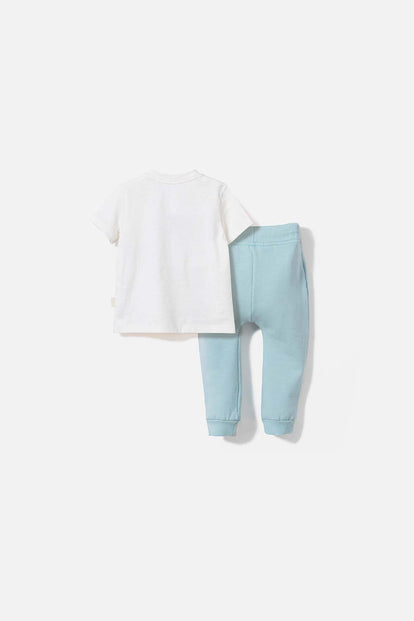 CONJUNTO DE LOONEY TUNES CON PANTALÓN MARFIL Y AZUL BEBÉ UNISEX